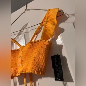 Women’s medium bathing suit top with tie back